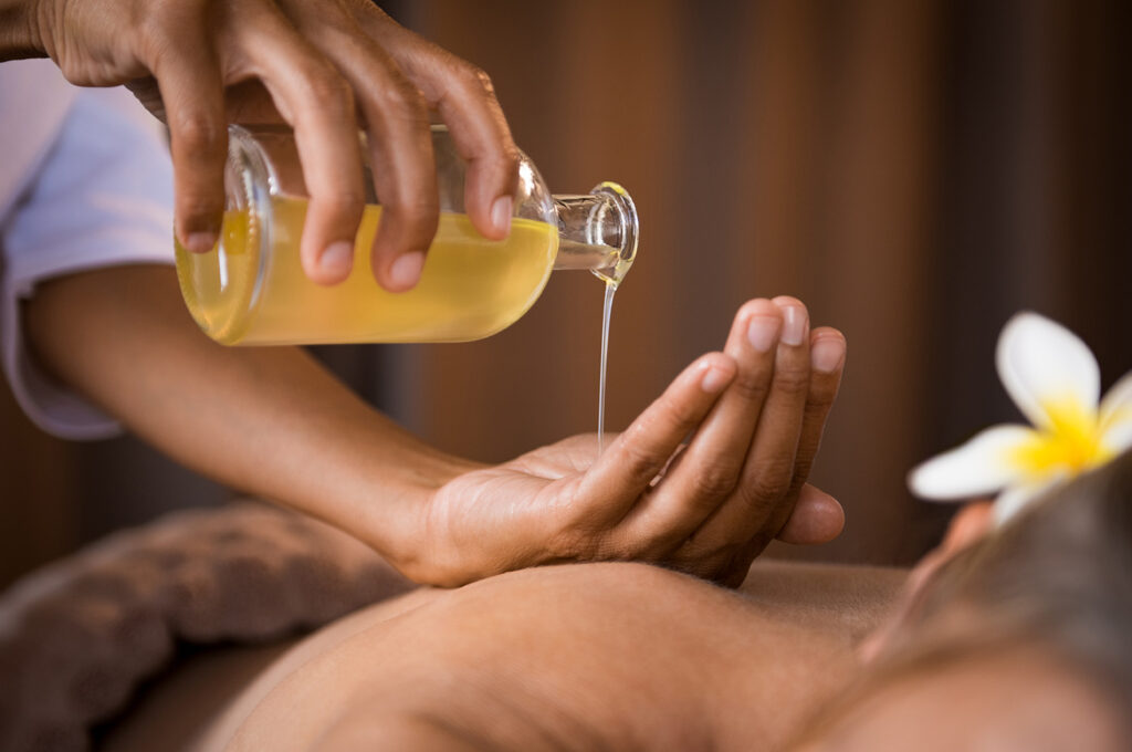 Harmony Benessere • therapist pouring massage oil at spa 2021 08 26 15 34 42 utc